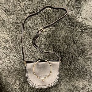 Melissa Bianco black leather side body bag. Black with unique gold ring